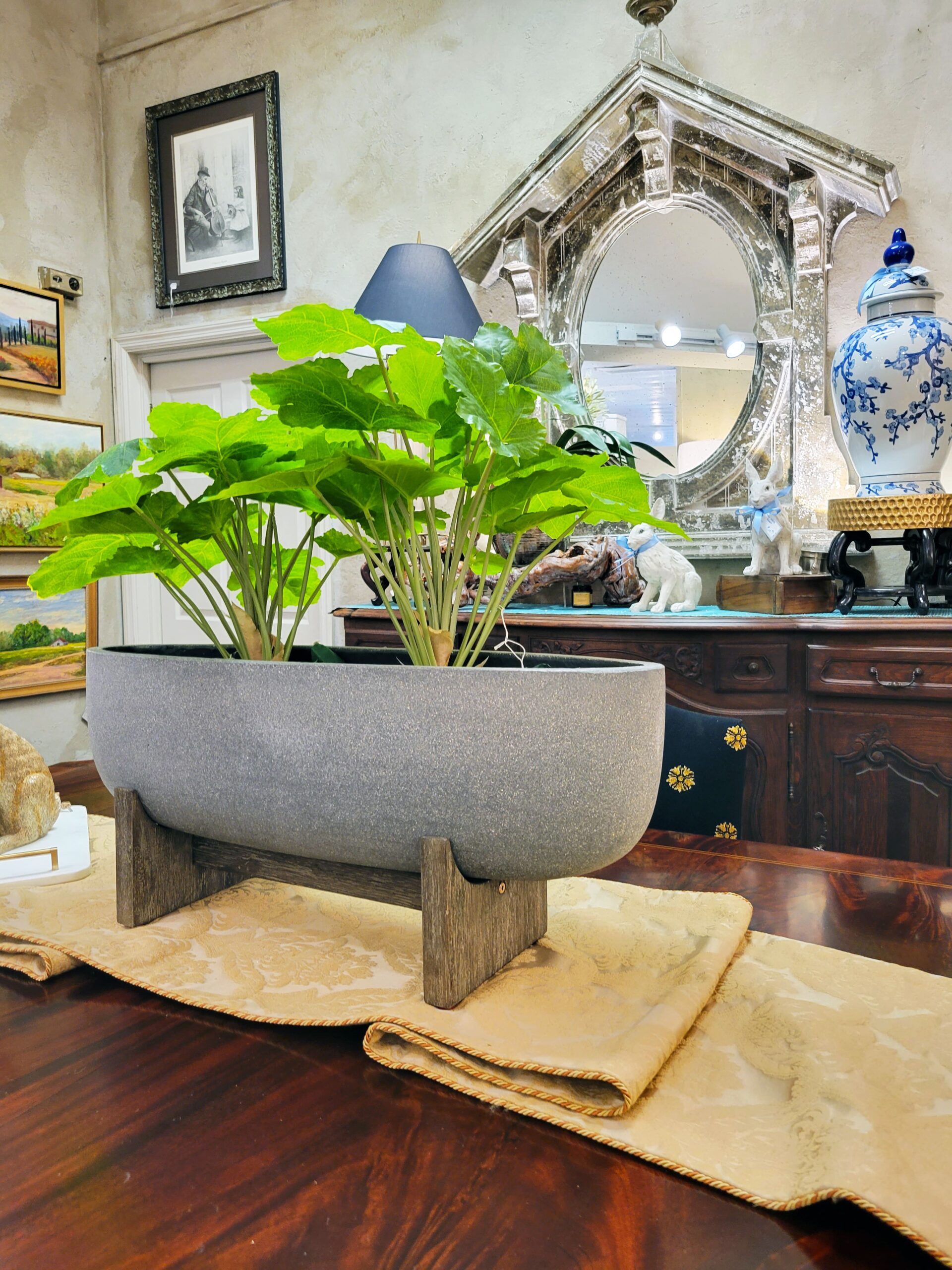 wide planter and antique mirror