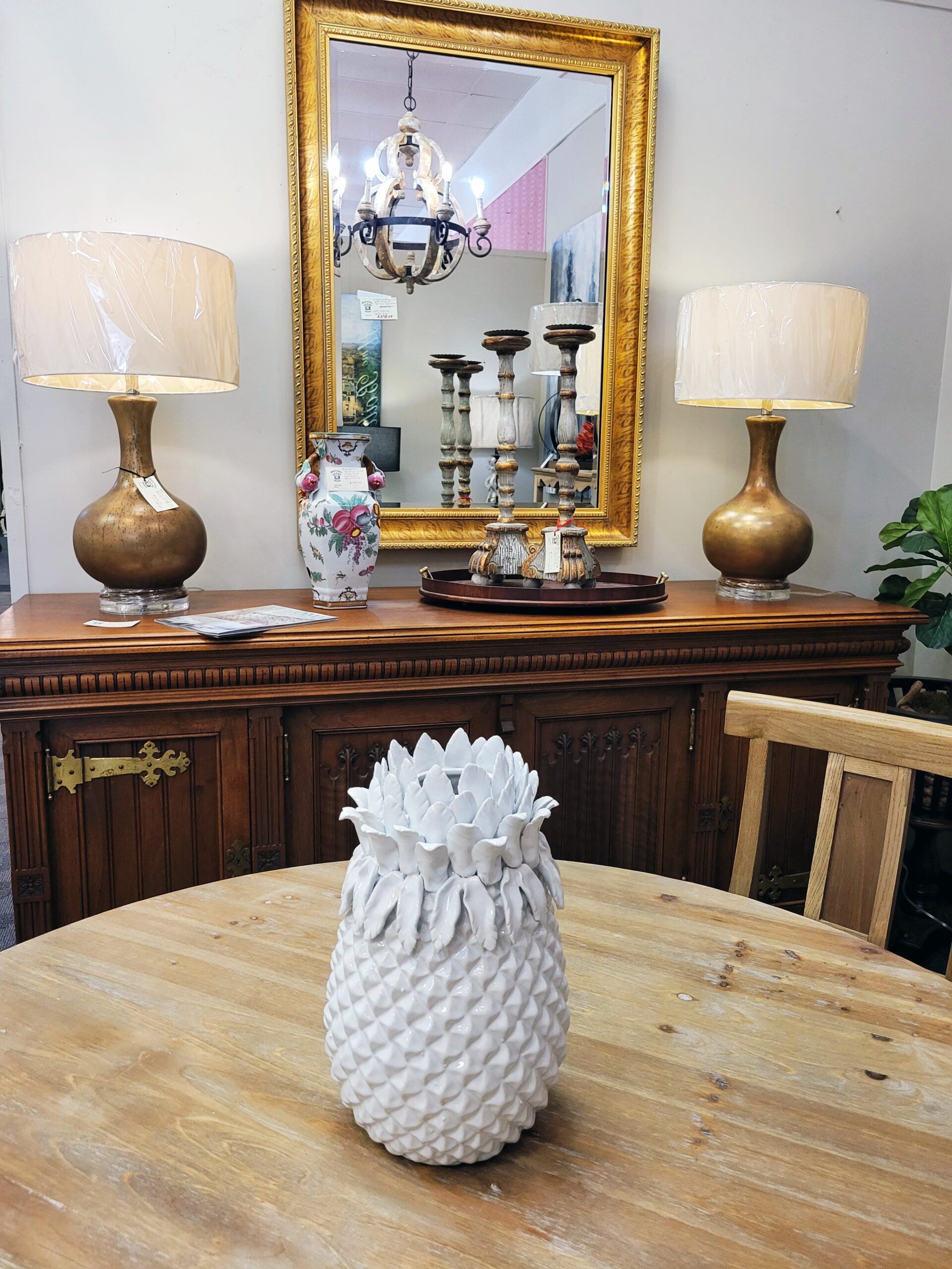 antique mirror and side board with bronze lamps