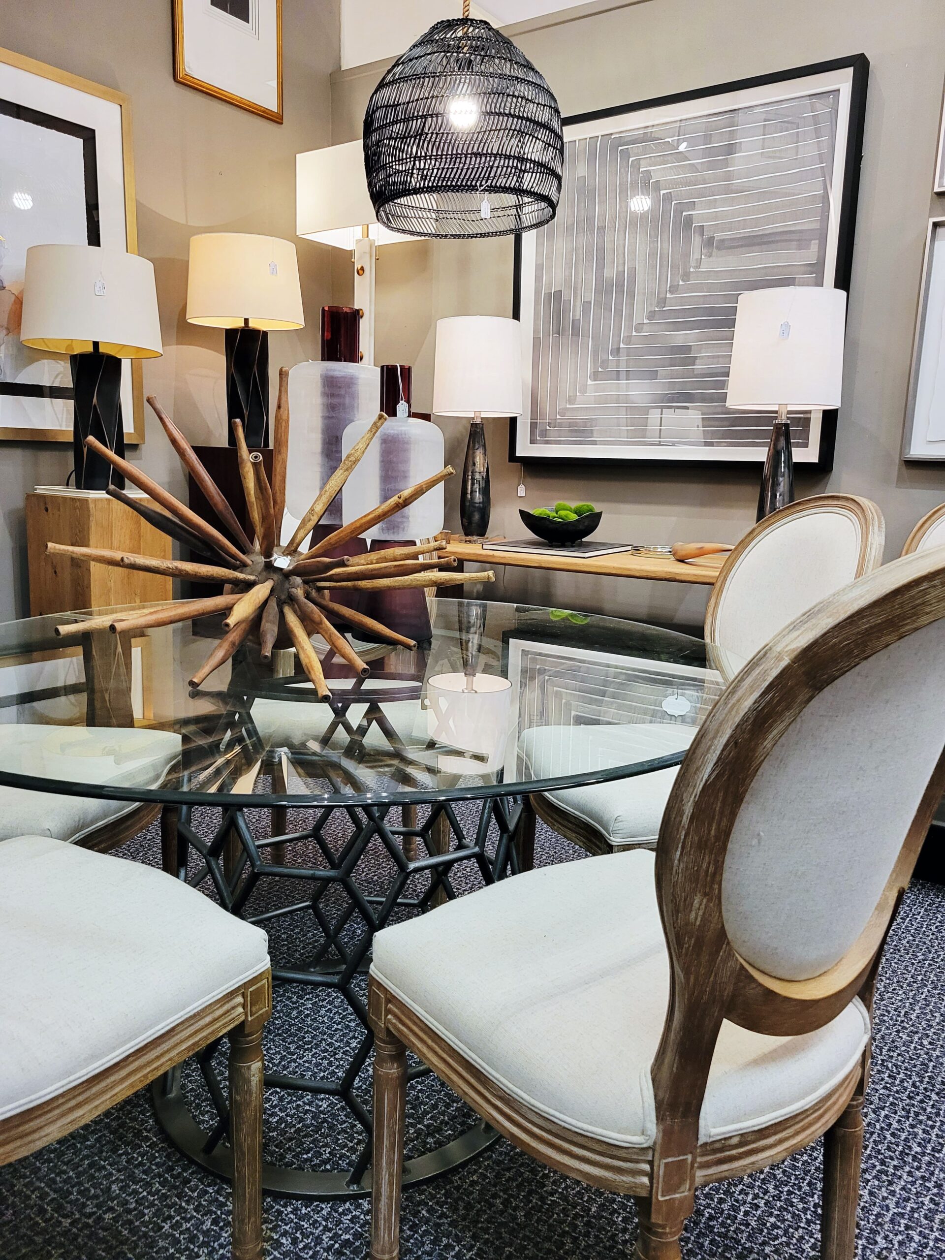 class dining table with wicker chandelier