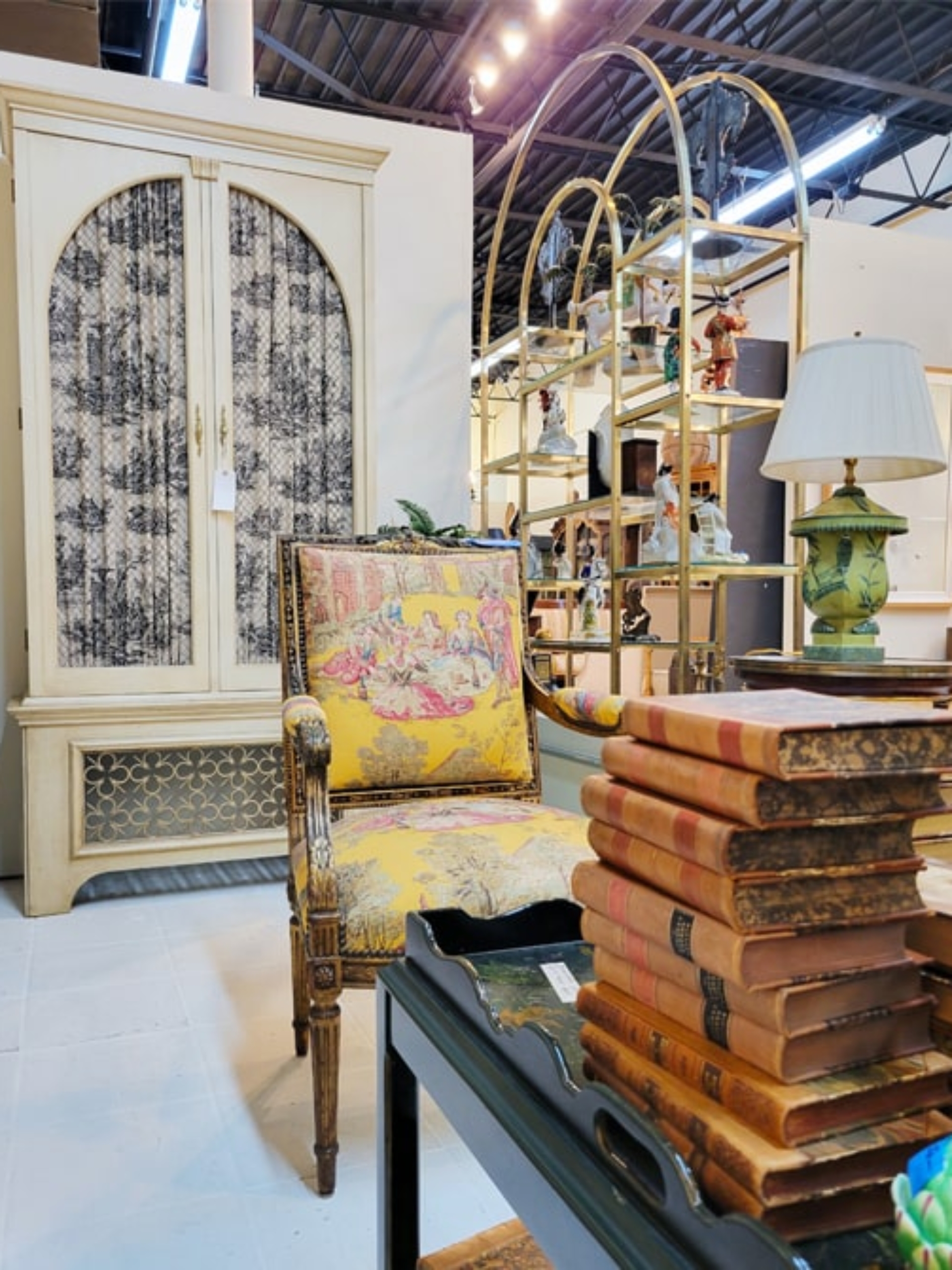 antique dresser and chair with leather books